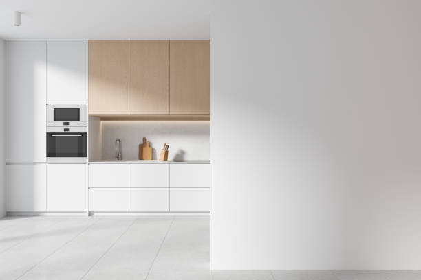 istock Stylish home kitchen interior with cooking space and kitchenware, mock up wall 1801925411