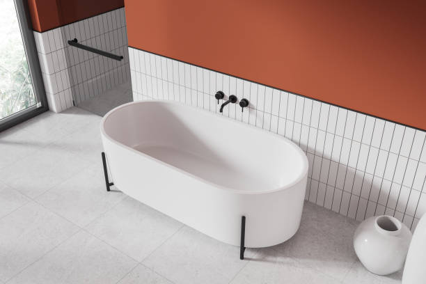 istock Orange and white bathroom interior with tub and shower, top view 1801928004