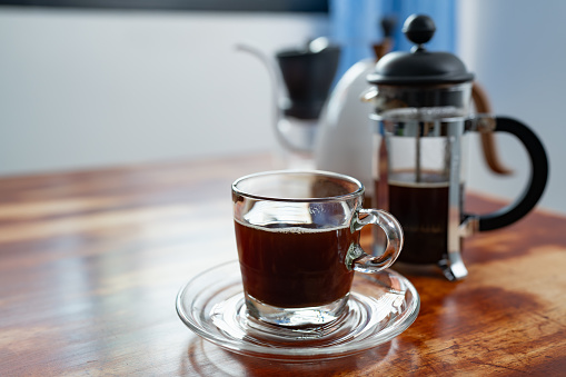 A cup of French press coffee on a table