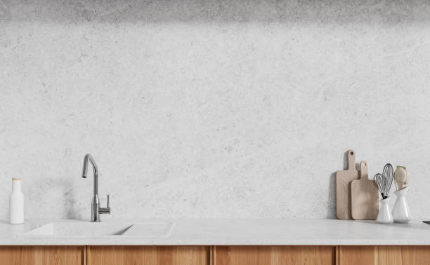 istock Wooden cabinets and sink in white kitchen 1801935825