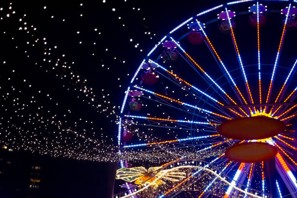 istock an illuminated ferris wheel at night with fairy lights 1801960540