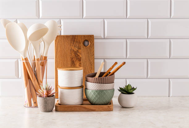 istock Set of eco-friendly utensils on a light kitchen countertop against a white brick wall with a copy of the space. Front view. Eco style. 1801960551