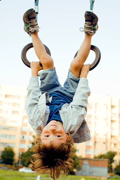 istock little cute boy on playground outside 180197523