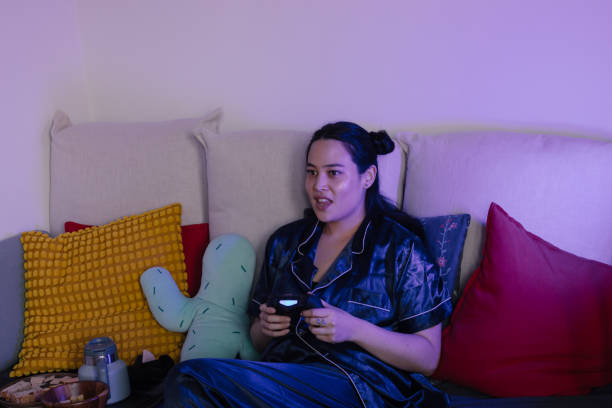 istock Mixed Race Woman Playing Games 1801980100