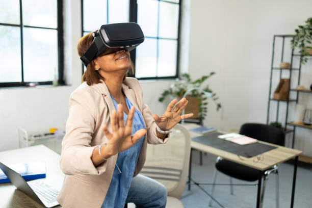 istock Businesswoman having fun with virtual reality glasses 1801997090