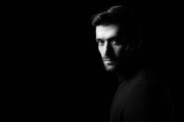 istock Pride young business man portrait Attractive bearded guy get confident He look at camera Smart man stand in the dark room Confidence Cool man get successful of business Business Fashion concept 1801998663