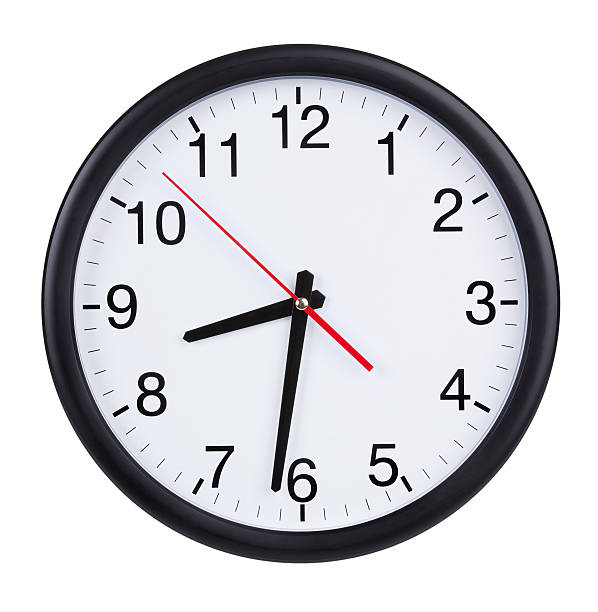 istock Office clock shows half of the ninth 180200557