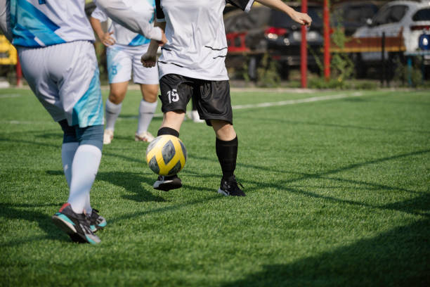 istock Female footballers tackling 1802009183