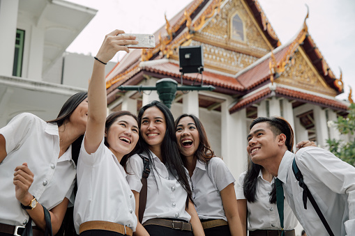 Group of young university students enjoying together in Bangkok.