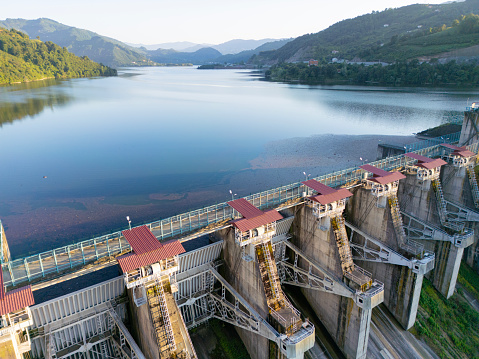 Water flowing over floodgates of a dam at Khun Dan Prakan Chon, Nakhon Nayok Province, Thailand