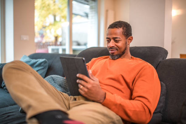 istock Relaxed Digital Time for Mid Adult Black Male 1802052018