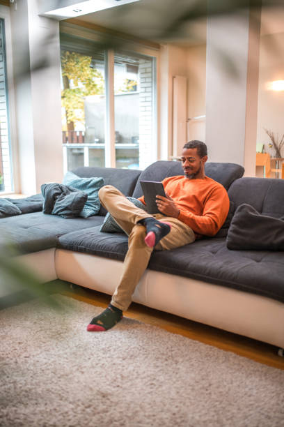 istock Relaxed Digital Time for Mid Adult Black Male 1802052019