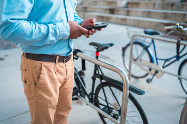 istock Indian Man Using Smartphone for Online Banking Outdoors 1802053186