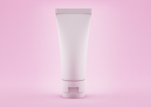 Mockup of white plastic tube for medicine or cosmetics - cream, gel, skin care, toothpaste isolated on pink background
