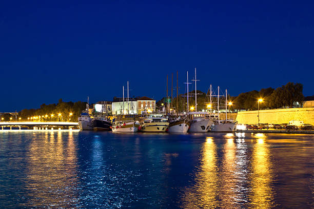 istock Fishing boats in safe harbor on evening 180207108