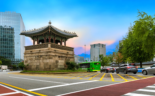 Seoul, South Korea: August 6, 2023: The ancient watchtower of Gyeongbokgung Palace, named Dongsipjagak, is located at the eastern corner of the palace walls and is considered a cultural and historical treasure of South Korea.