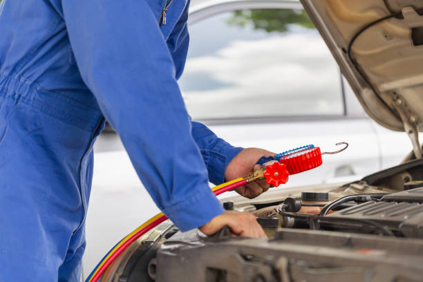istock Car Air Conditioning Repair, Technician checked car air conditioning system refrigerant recharge, Repairman check and fixed car air conditioner system 1802104688