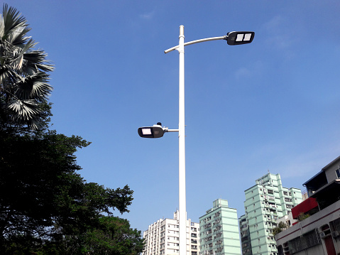 LED street lights lit under the blue sky.White street lamp under blue sky