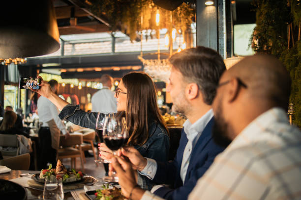 istock Business team on a business lunch taking a selfie 1802150496