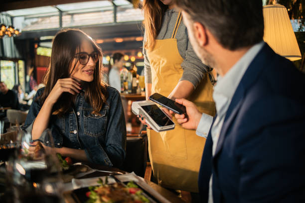 Businessman paying for a business lunch