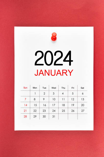 istock A January 2024 calendar page with push pin on red background. 1802151757