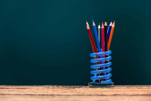 School Board and colored pencils. The concept of education, study, learning, elearning. Back to school
