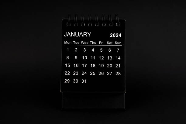 istock Black Calendar for January 2024. Desktop calendar on a black background. 1802154272