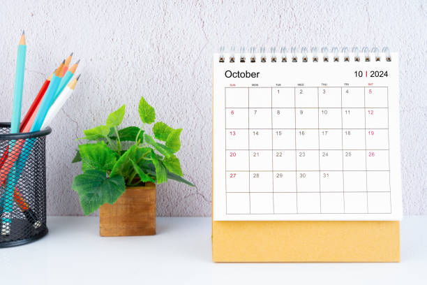 October 2024 Desk Calendar with pencil.