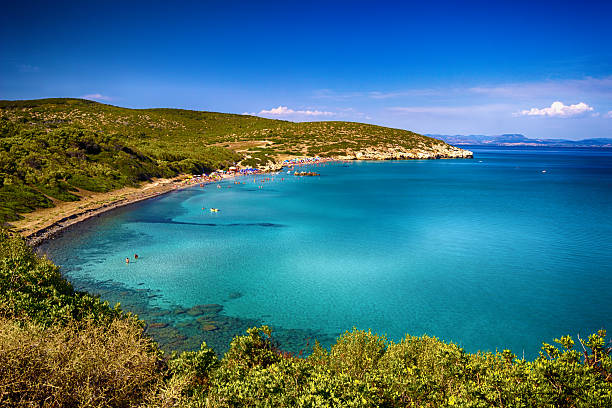 red rocks emerging from the sea along the sunny coast of Sardinia