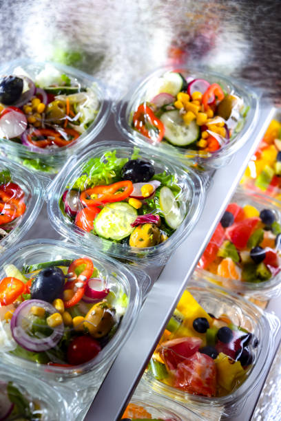 istock Boxes with fruit and vegetable salads in a commercial fridge 1802162802