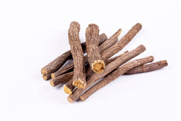 istock Liquorice root isolated on white background 1802165578