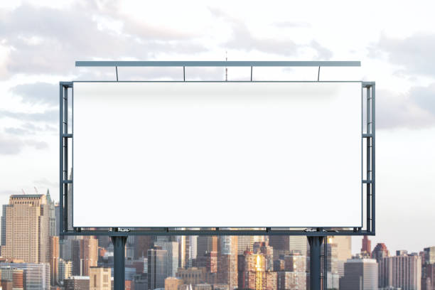 istock Blank white horizontal billboard on cityscape background at daytime, front view. Mockup, advertising concept 1802167723