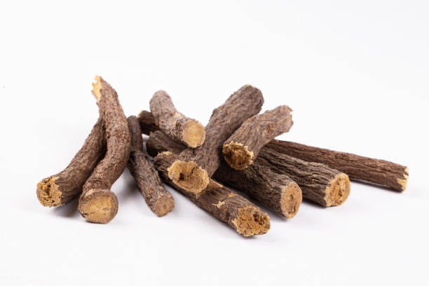 istock Liquorice root isolated on white background 1802172168