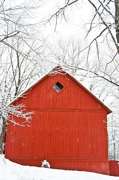 istock Side view of red barn in winter 180221250