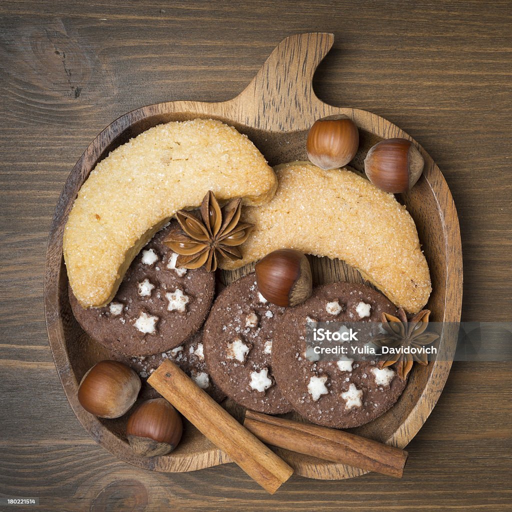 cookies, spices and nuts on a wooden plate cookies, spices and nuts on a wooden plate, close-up Anise Stock Photo