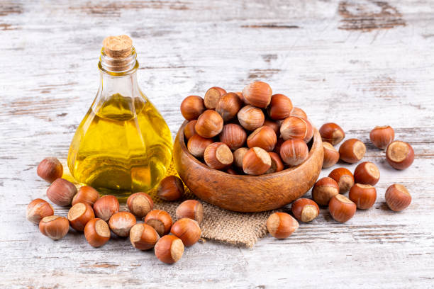 istock Shelled hazelnuts and hazelnut oil 1802221474