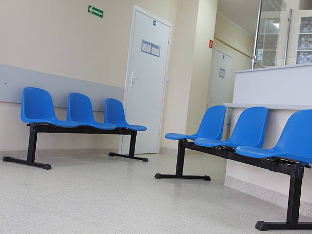 istock waiting room blue chairs on the floor 180223573
