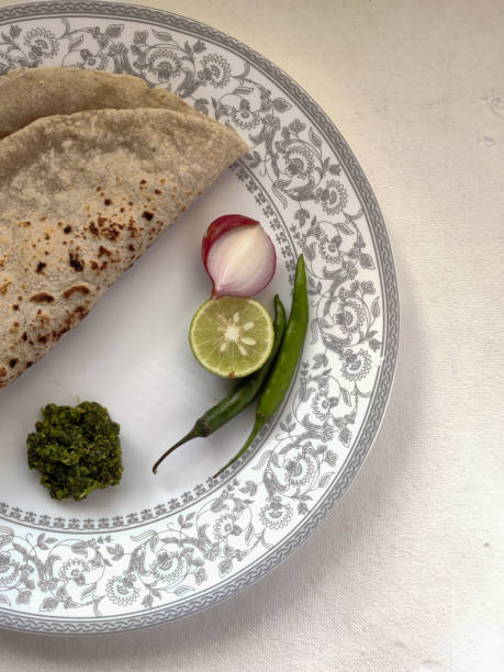 istock Indian flat bread served with green chilli chutney traditionally called as Theccha in Marathi 1802237557