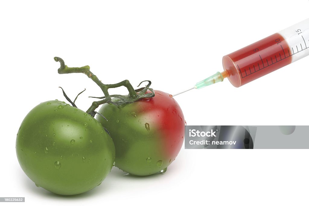 Classé Seringue avec tomates vertes et rouges - Photo de ADN libre de droits