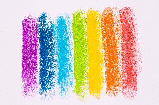 Close-up photo of colored crayons taken in a light box with a white background.  The best friend of children who love to draw, especially children who are different from others.