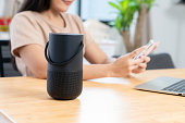 Home modern technology concept, smart portable wireless speaker on the table.
