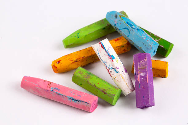 istock Colorful pastel crayons with painting background 1802287272