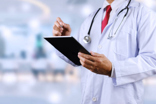 istock The doctor is checking the patient's detailed information 1802290547