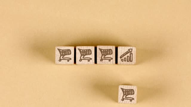 Wooden Blocks with Shopping Cart Icons.