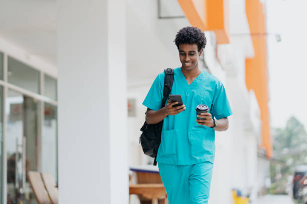 Young African healthcare worker walking to work