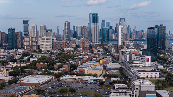 Historical Downtown with Hamilton park in Jersey City, New Jersey. Financial and Business skyscrapers of the Manhattan Downtown shown in the distance