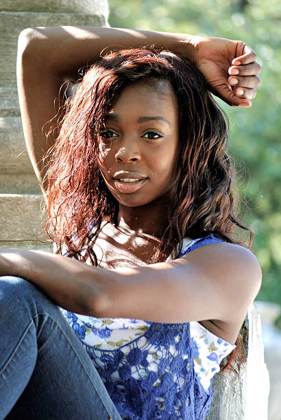 istock young woman relaxing in the park 180231852