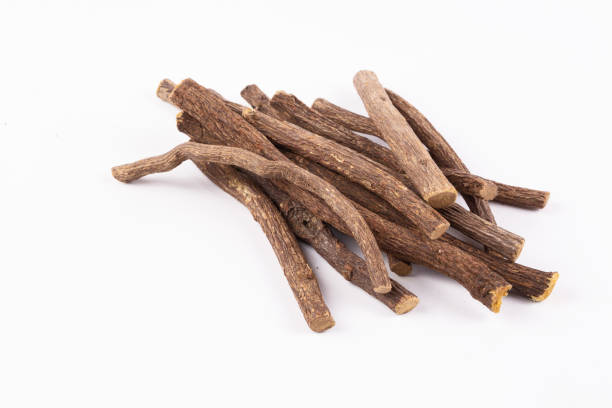 istock Liquorice root isolated on white background 1802320260