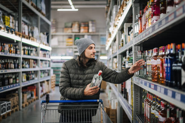 istock Man in a liquor store. 1802321318