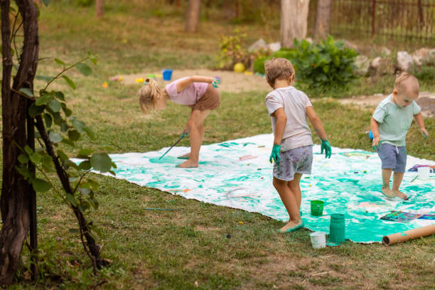 istock Funny kid painting and playing with flippers 1802328807